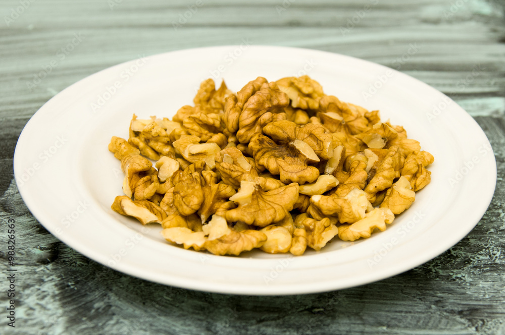 Walnuts Shelled on Texture Background in Blue Walnuts Shelled on Texture Background in Blue