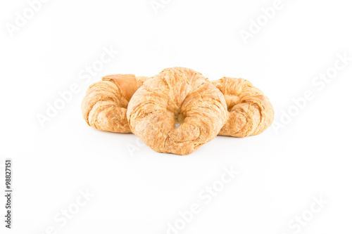 fresh and tasty croissant on basket wooden isolated in white bac
