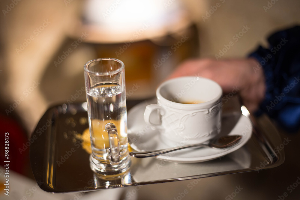Waiter serving coffee at the restorant Waiter serving coffee at the restorant