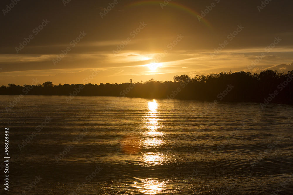Naklejka premium Colorful sunset on the river Amazon in the rainforest, Brazil