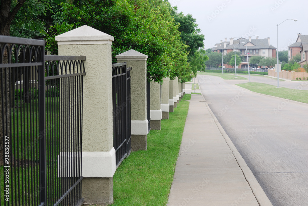 community fence by the road side in residential area