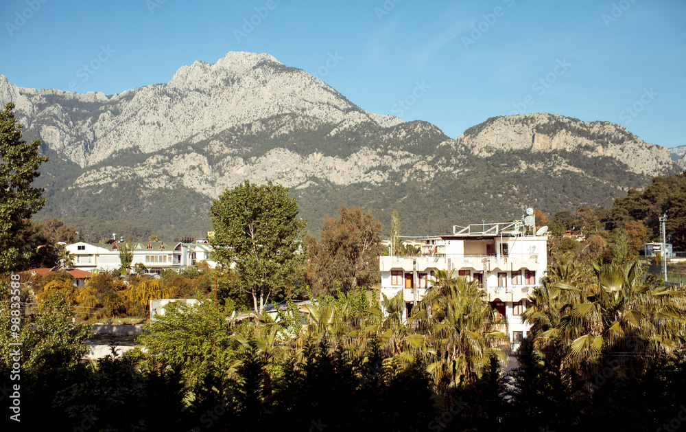 Obraz premium small town,mountains and blue sky