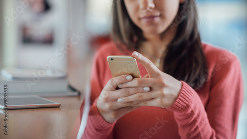 Cute girl texting with her mobile