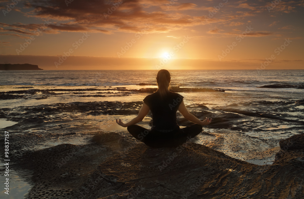 Meditating or yoga by the sea