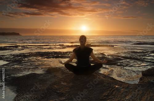 Meditating or yoga by the sea
