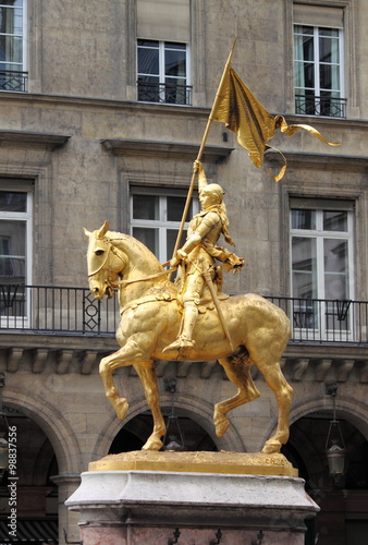Golden statue of Saint Joan of Arc in Paris, France photo