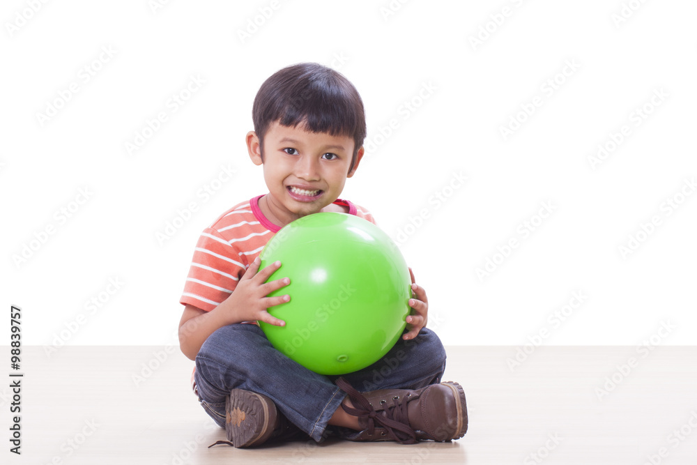 Fototapeta premium Little boy playing green ball