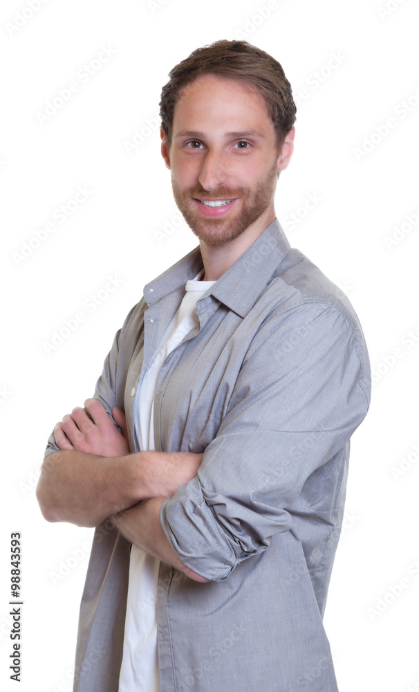 Motivierter junger Mann mit Vollbart und Jeans Motivierter junger Mann mit Vollbart und Jeans