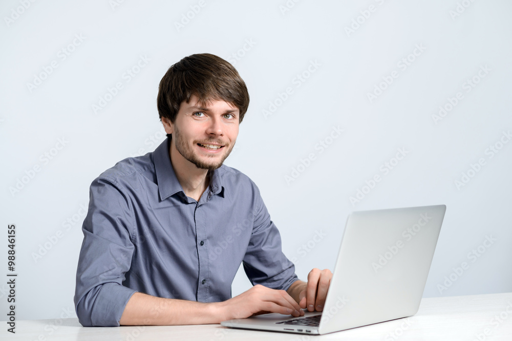 Young man working at laptop Young man working at laptop