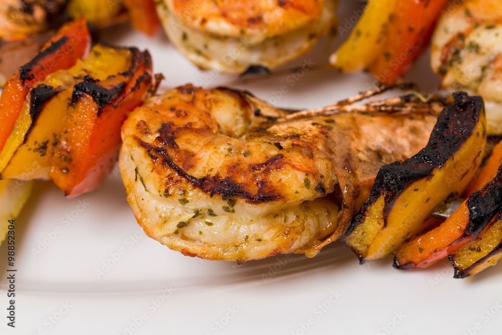 Delicious grilled shrimps on skewers. Delicious grilled shrimps on skewers.