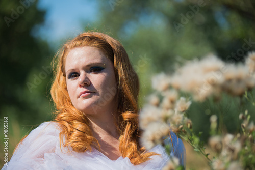 Young beautiful girl on a walk in the country