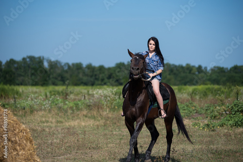 Young beautiful girl with a horse on nature © Solomkina Viktoria