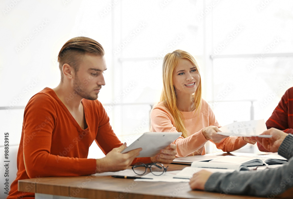 Fototapeta premium Young business people discussing a new project in a conference room