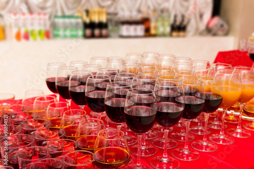 glasses with beverages on the banquet table