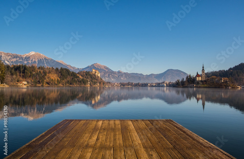A wooden dock  pier  on a lake