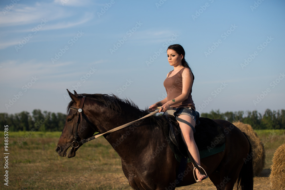Young beautiful girl with a horse on nature Young beautiful girl with a horse on nature