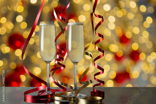  Glasses of champagne for celebrations with abstract bokeh backg
