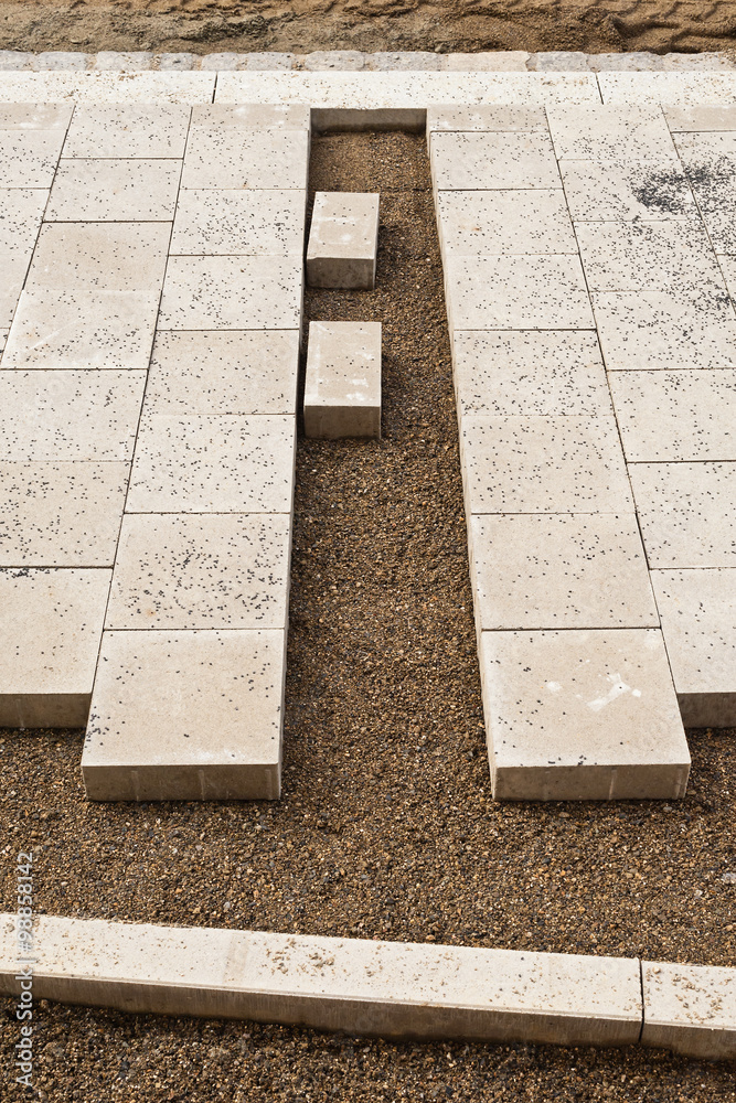 Strassenbau und Wegebau Verlegen von Gehwegplatten aus Beton Stock