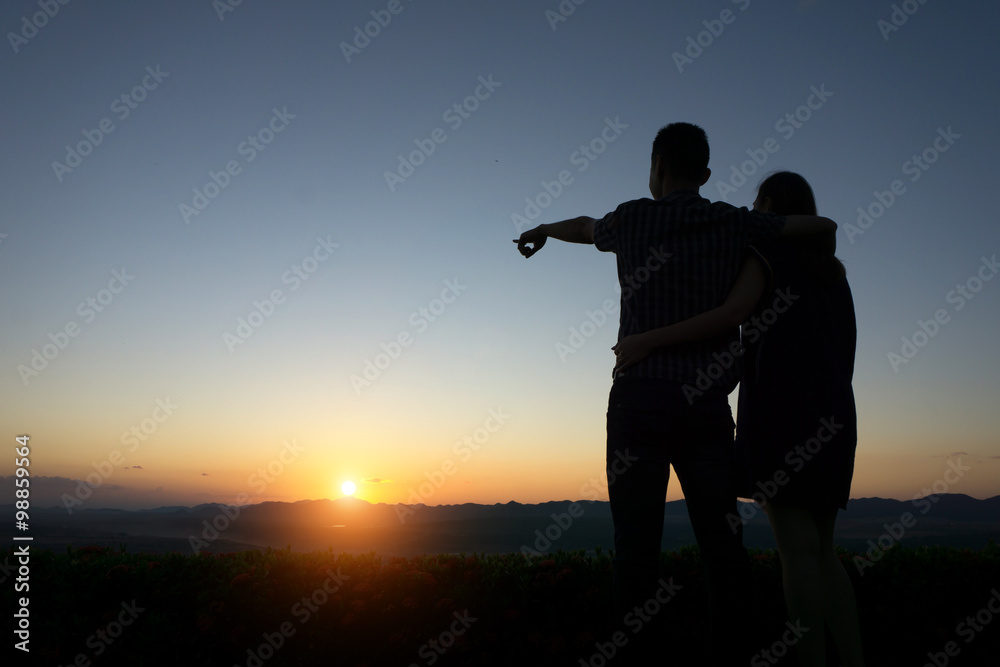 silhouette lovers Hands up against sunset