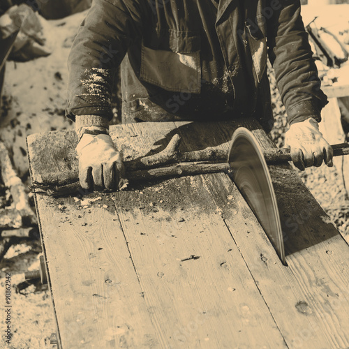 Man working with circular saw blade