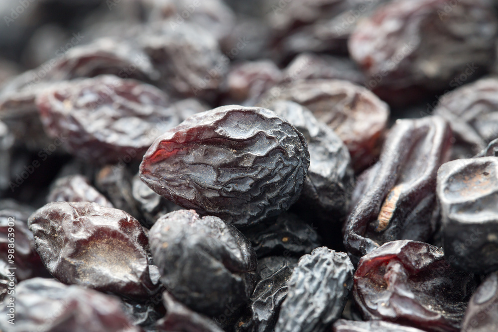 Black raisins as background. macro Black raisins as background. macro