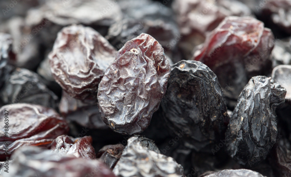 Black raisins as background. macro Black raisins as background. macro