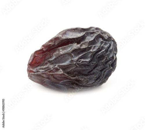 Black raisins on a white background. macro