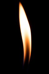 a flame of fire from the cigarette lighter on a black background