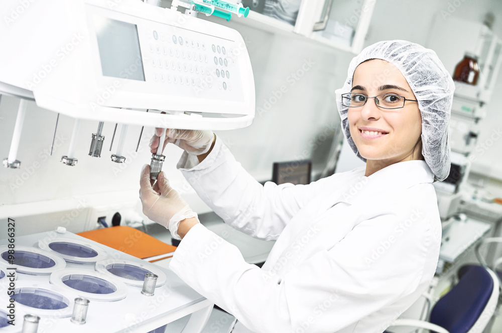 Pharmaceutical researcher making dissolution test Pharmaceutical researcher making dissolution test