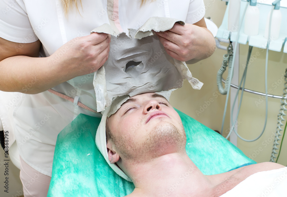 man in the mask cosmetic procedure in spa salon man in the mask cosmetic procedure in spa salon