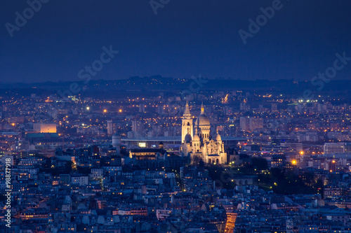 PARIS - 6 AUGUST 2013: Illuminated Eiffel Tower at night and peo