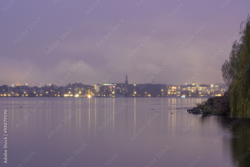 Serene cityscape landscape scene. Long exposure, blurry sea/rive