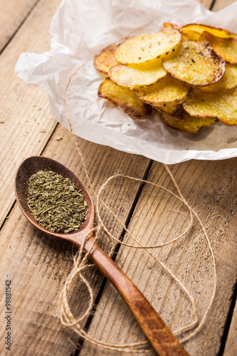Fototapeta Naklejka Na Ścianę i Meble -  Homemade potato chips with spices