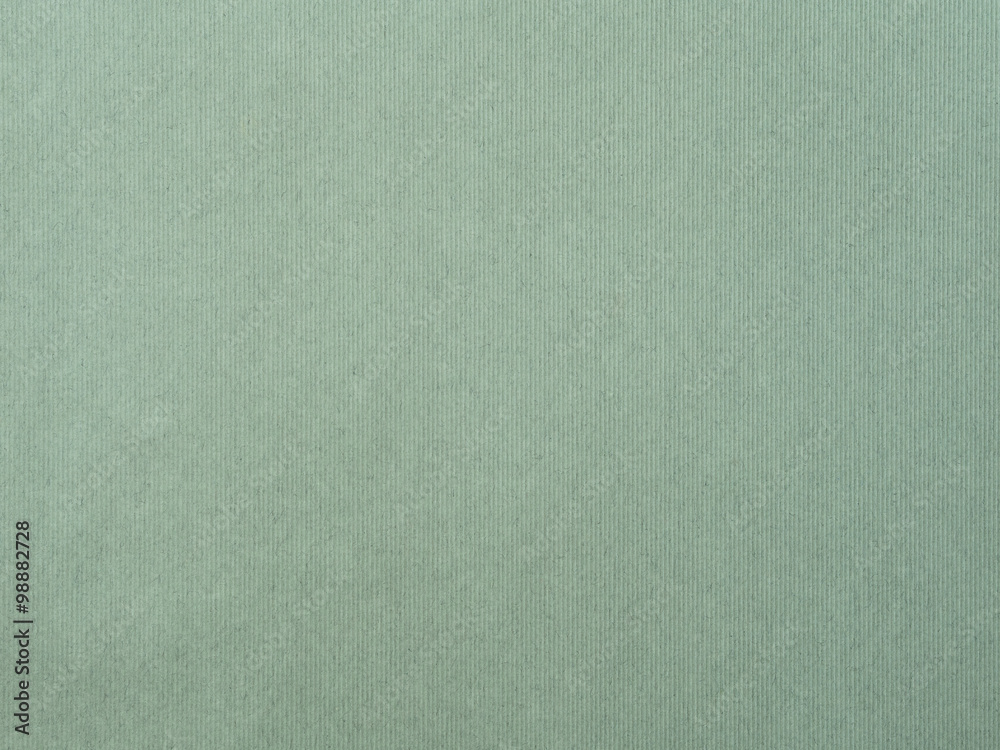 The paper with vertical line texture on green color The paper with vertical line texture on green color