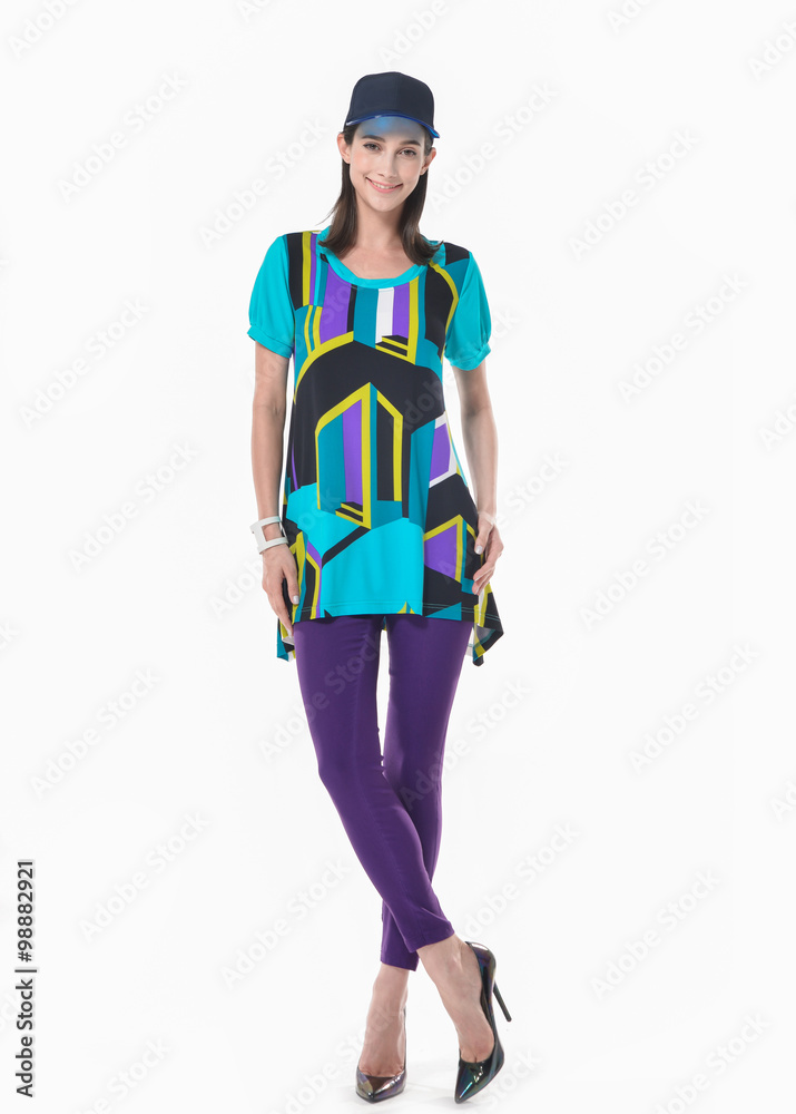 Full body fashion model in fashion dress standing posing in the studio
Full body fashion model in fashion dress standing posing in the studio