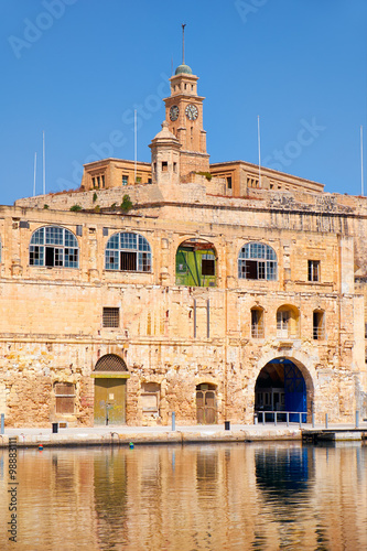 The old dock building at Bormla (Cospicua) waterfront. Malta. photo