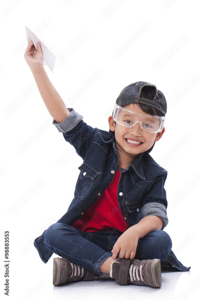 Happy boy playing with paper airplane Happy boy playing with paper airplane