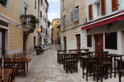 Old town street with restaurants  in Porec  in Croatia