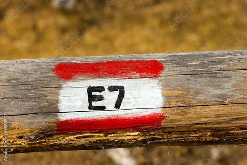 European Trail Sign E7 on a Wooden Pole / European Trail Sign E7 (Lisbon Portugal - Constance Lake Romania) on a wooden pole photo