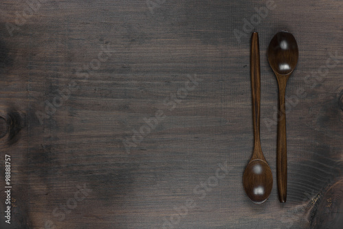 Wooden spoons on a dark background