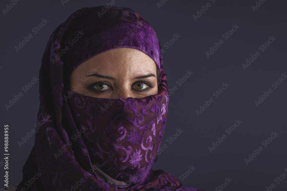 ethnic Beautiful arabic woman with traditional burqa veil