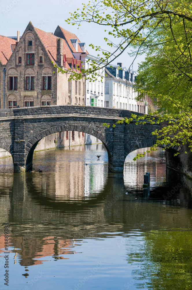 Bridge in Bruges, with reflection in canal