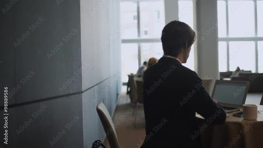 Scene of the Modern professional using Business Technology Scene of the Modern professional using Business Technology
