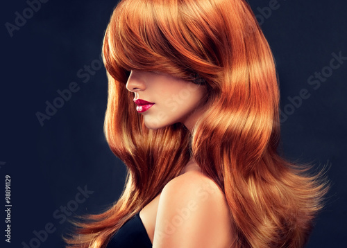 Fototapeta Beautiful model girl  with long red curly hair