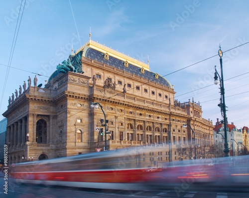 Evening tram  passes by  the National Theatre in Prague