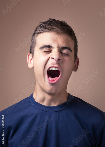 Sleepy and tired young man photo