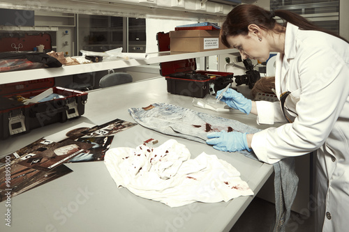 Checking blood stains in laboratory photo