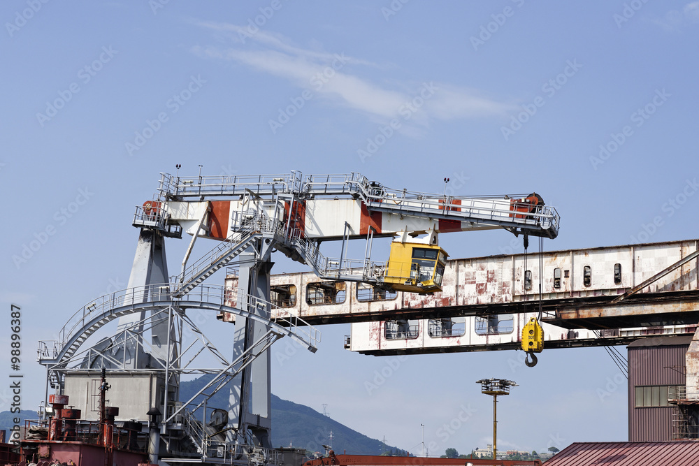 big crane in the harbour of genova