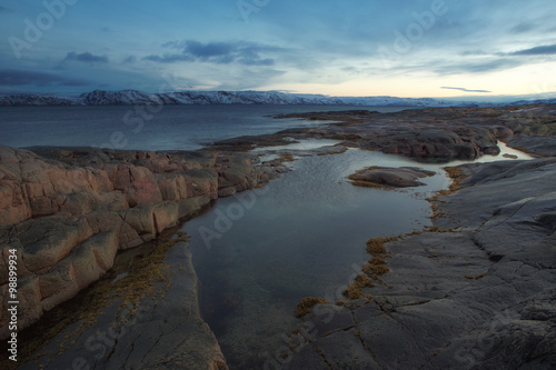 Granite Beach and across the bay. Barencevo sea. Kola Peninsula. Murmansk region. Russia. © olenyok