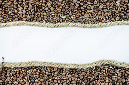 Roasted coffee beans beside the rope
